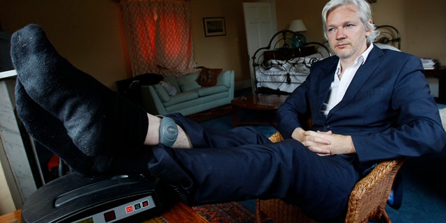 June 15, 2011: WikiLeaks founder Julian Assange is seen with his ankle security tag at the house where he is required to stay in, near Bungay, England.