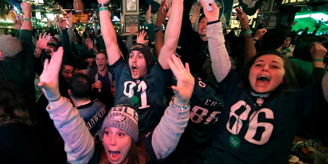 Fans react to an Eagles touchdown during Super Bowl 52 between the Philadelphia Eagles and the New England Patriots, Sunday, Feb. 4, 2018, in Philadelphia.