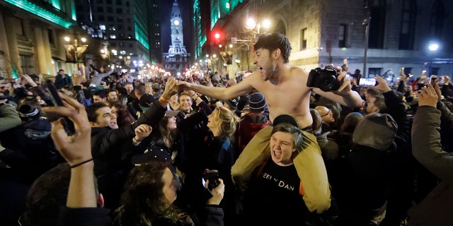 Philadelphia Eagles fans celebrate the team's victory in the NFL Super Bowl 52 between the Philadelphia Eagles and the New England Patriots, Sunday, Feb. 4, 2018, in downtown Philadelphia.