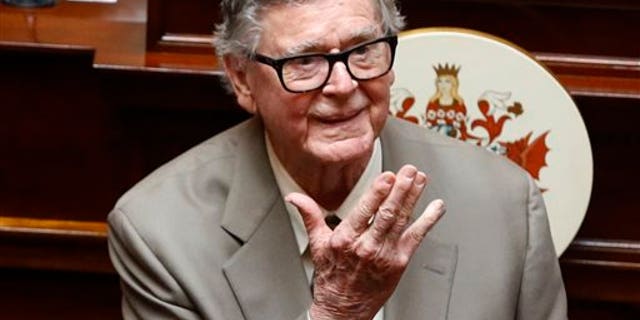 In this Wednesday, April 3, 2013 file photo, author Earl Hamner Jr. blows a kiss to relatives in the gallery as he is honored by the Virginia Senate at the state capitol in Richmond, Va. Hamner died on March 24, 2016. (AP Photo/Richmond Times-Dispatch, Bob Brown)