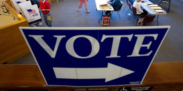 Oct. 25, 2012: Voters cast their votes through absentee ballots for the Nov. 6th election at the town hall in Cape Elizabeth, Maine.
