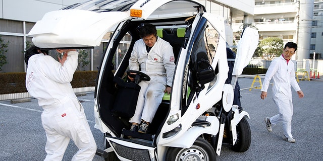 Four Link Systems, Inc's fully electric foldable vehicle 'Earth-1' which was designed by Kunio Okawara, famous in Japan as the artist behind the long-running wildly popular robot anime "Gundam", is seen in Tokyo, Japan December 27, 2017. Picture taken December 27, 2017. REUTERS/Toru Hanai - RC156C185F10