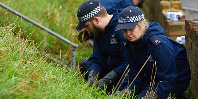 Police search the home of British actress Sian Blake in Erith, England.
