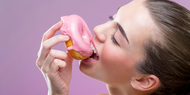 eating a donut istock large
