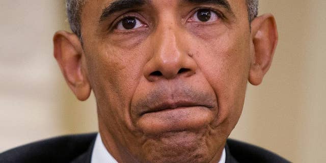 President Barack Obama pauses while speaking to members of the media in the Oval Office of the White House in Washington, Monday, June 13, 2016, after getting briefed on the investigation of a shooting at a nightclub in Orlando by FBI Director James Comey, Homeland Security Secretary Jeh Johnson, and other officials. (AP Photo/Pablo Martinez Monsivais)