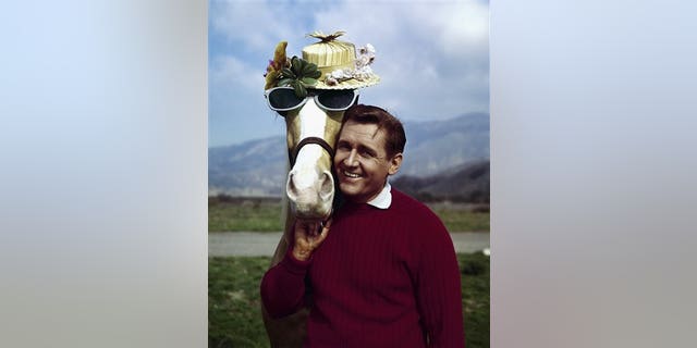 FILE - In this March 22, 1962 file photo, actor Alan Young poses with the "Mister Ed," horse. Young died Thursday, May 19, 2016. He was 96. (AP Photo, File)