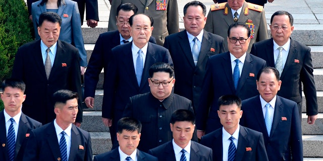North Korean leader Kim Jong Un, center, is surrounded by his security guards upon his arrival for a meeting with South Korean President Moon Jae-in at the North Korean side of Panmunjom in the Demilitarized Zone., April 27, 2018.