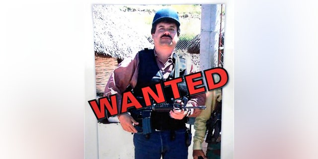 FILE - In a Thursday, Feb. 14, 2013, file photo, a poster displayed at a Chicago Crime Commission news conference in Chicago, shows Joaquin ``El Chapo'' Guzman, who was deemed Chicago's Public Enemy No. 1. In a scheme befitting a caper movie, Mexico's most powerful drug lord, Joaquin "El Chapo" Guzman, escaped late Saturday July 11, 2015 from a maximum security prison through a 1.5-kilometer (1 mile) tunnel from a small opening in the shower area of his cell, the country's top security official announced. (AP Photo/M. Spencer Green, File)