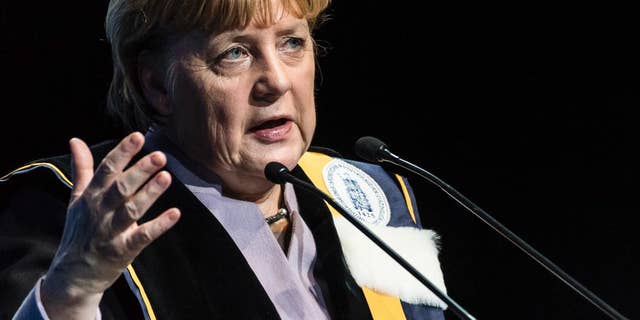 German Chancellor Angela Merkel talks after she was given an honorary doctorate by the University of Leuven and the University of Ghent during an academic ceremony in Brussels on Thursday Jan. 12, 2017. Merkel received the honorary doctorate for her diplomatic and political efforts to develop the political strength of Europe, and to defend the values that allow Europe to find unity in diversity. (AP Photo/Geert Vanden Wijngaert)