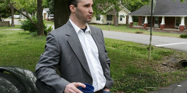FILE - In this Tuesday April 23, 2013, file photo, James Everett Dutschke stands in the street near his home in Tupelo, Miss. A change-of-plea hearing is scheduled for Dutschke a man charged with sending poison-laced letters to President Barack Obama and other officials. James Everett Dutschke is scheduled for a hearing in U.S. District Court in Oxford on Friday afternoon, Jan. 17, 2014 according to court documents. (AP Photo/Northeast Mississippi Daily Journal, Thomas Wells, File) MANDATORY CREDIT