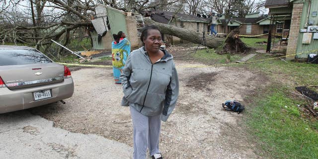 Faye Green was rescued through a bedroom window by her daughter after a large pecan tree fell on her home Tuesday in Wharton.