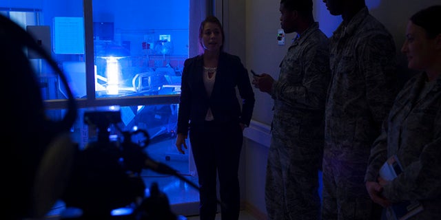 A spokesperson for the company that made the robot explains how the machine works to staff at Hospital Langley.