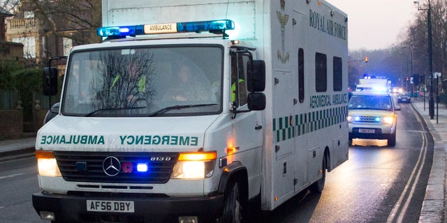 A convoy carrying a female Ebola patient arrives at the Royal Free Hospital in London December 30, 2014. REUTERS/Neil Hall