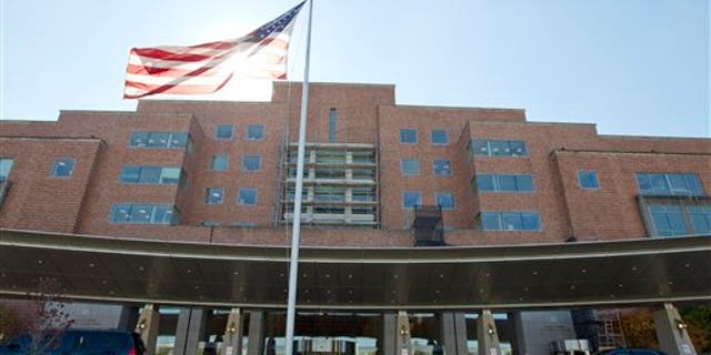 FILE - In this Oct. 17, 2014 file photo, The National Institutes of Health Mark O. Hatfield Clinical Research Center where patients with Ebola are treated is seen in Bethesda, Md. (AP Photo/Jose Luis Magana, File)