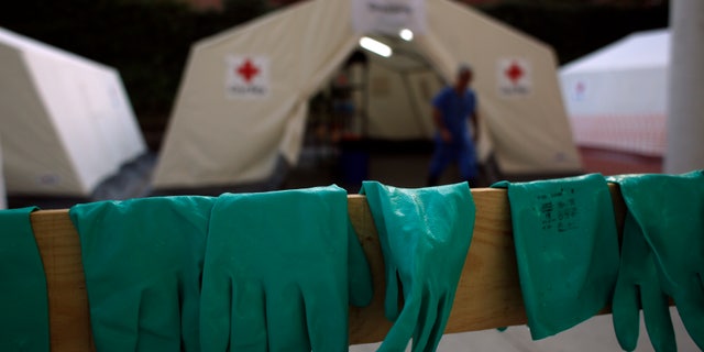 Gloves are left to dry after an Ebola training session held by Spain's Red Cross in Madrid October 29, 2014. REUTERS/Susana Vera