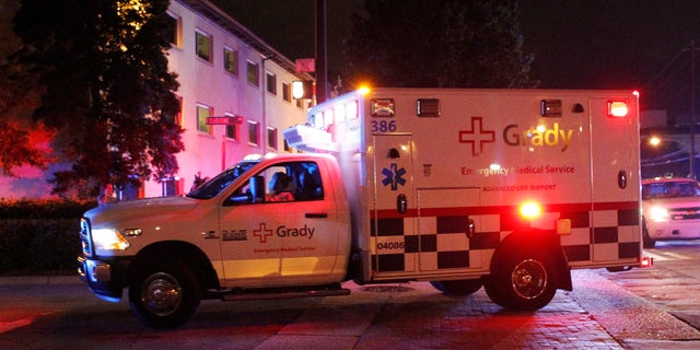 An ambulance transporting Amber Joy Vinson, a U.S. nurse who has Ebola, arrives at Emory University Hospital in Atlanta, Georgia October 15, 2014. REUTERS/Tami Chappell