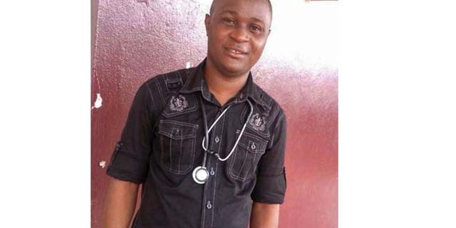 Dec. 1, 2014: Ebola virus survivor Doctor Komba Songu-Mbriwa poses for a photo at the Hastings Ebola Treatment Centre on the outskirts of the capital city of Freetown, Sierra Leone. (AP)