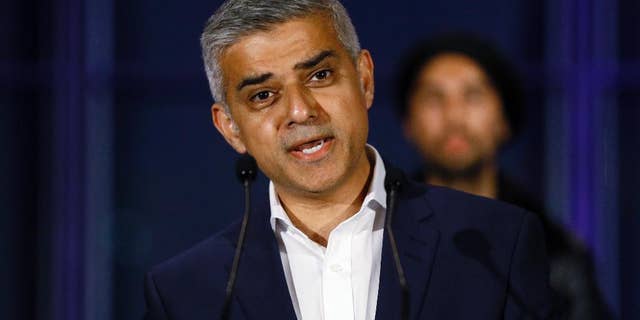 FILE - In this file photo dated Saturday, May 7, 2016, Sadiq Khan, speaks on the podium at City Hall in London, Saturday, May 7, 2016. London’s mayor, Khan on Sunday June 12, 2016, pledged to fight until the moment the polls close to persuade Britons to vote to remain inside the European Union bloc, in the upcoming June 23 referendum.(AP Photo/Kirsty Wigglesworth, FILE)