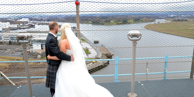The sky-high ceremony lasted 15 minutes before they all posed for some pictures.