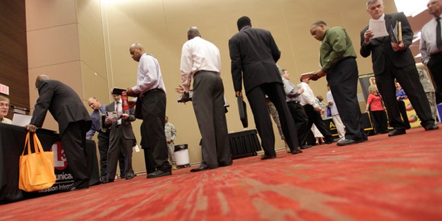 July 19, 2012: Job seekers line up to speak to a recruiter during a job fair in Irving, Texas.