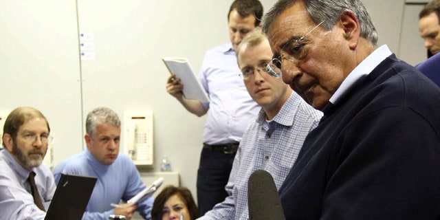 Oct. 2: U.S. Secretary of Defense Leon Panetta answers questions aboard an Air Force plane over the Atlantic Ocean.
