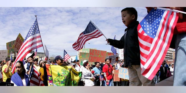 HEMPSTEAD, NY - MAY 1: Immigration demonstrators gathered for a rally at Hempstead Village Hall as part of the "Day Without Immigrants" national protest May 1, 2006 in Hempstead, New York. On October 27, 2011, a report that immigrants, including Latinos, are thriving on Long Island. (Photo by John Dunn/Getty Images)