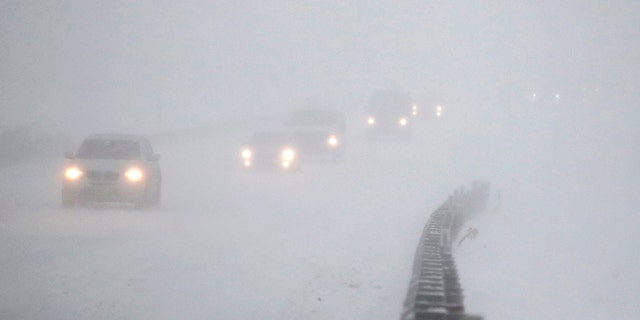 Vehicles commute southbound on the Garden State Parkway in whiteout conditions during the snowstorm on Thursday.