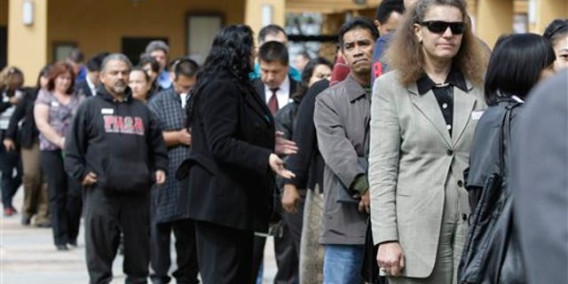 Job applicants wait in line at a job fair in San Jose, California.