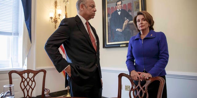 Homeland Security Secretary Jeh Johnson, left, meets with House Minority Leader Nancy Pelosi, D-Calif.