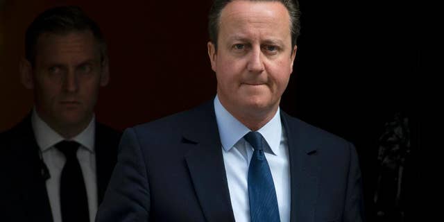 Britain's Prime Minister David Cameron leaves 10 Downing Street for the House of Commons to attend his weekly Prime Ministers Questions in London, Wednesday, April, 27, 2016. (AP Photo/Alastair Grant)