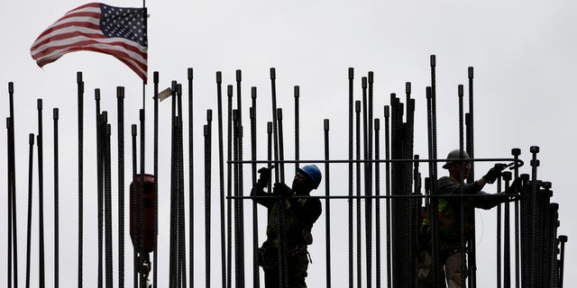 FILE -- April 27, 2015: rodbusters install rebar on the new Comcast Innovation and Technology Center under construction, in Philadelphia. The Commerce Department released first-quarter gross domestic product on May 29, 2015. (AP Photo/Matt Rourke, File)