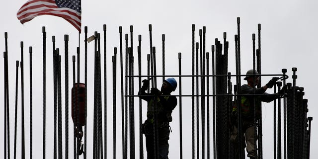 FILE -- April 27, 2015: rodbusters install rebar on the new Comcast Innovation and Technology Center under construction, in Philadelphia. The Commerce Department released first-quarter gross domestic product on May 29, 2015. (AP Photo/Matt Rourke, File)