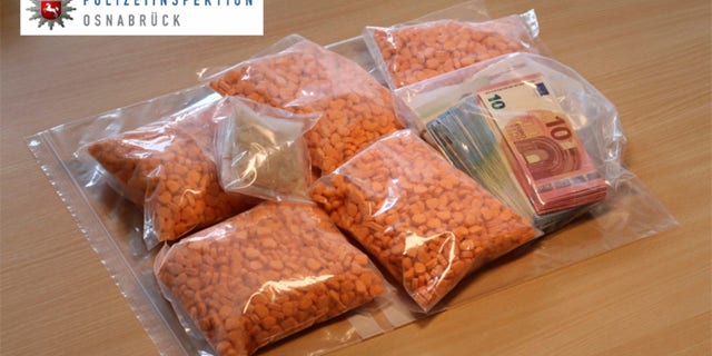 In this undated picture provided by the Osnabrueck , Germany, police department, ecstacy pills are on display. German police say they have seized thousands of ecstasy pills in the shape of President Donald Trumpâs head, a haul with an estimated street value of 39,000 euros ($45,900). Police in Osnabrueck, in northwestern Germany, say they found the drugs during a check Saturday Aug. 19, 2017 on an Austrian-registered car on the A30 highway. (Osnabrueck police via AP)