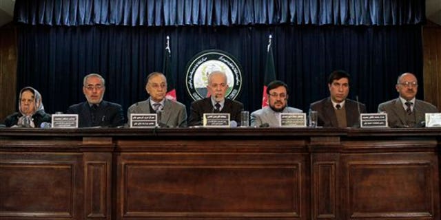 Jan. 7: Gul Rahman Qazi, center, head of an Afghan investigative commission, speaks during a news conference in Kabul, Afghanistan.