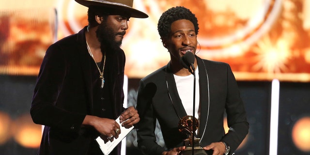 Gary Clark Jr. , left, and Jon Batiste announce that the award for best pop solo performance is won by Ed Sheeran at the 60th annual Grammy Awards at Madison Square Garden on Sunday, Jan. 28, 2018, in New York.