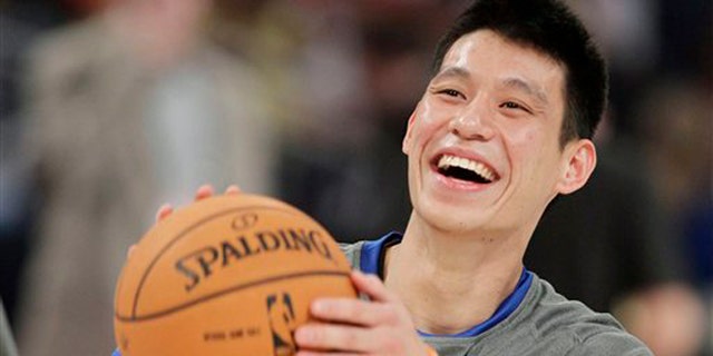 Feb. 24, 2012: This file photo shows New York Knicks' Jeremy Lin laughing during warmups before the start of the NBA All-Star Rising Stars Challenge basketball game in Orlando, Fla.