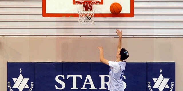 Feb. 28, 2012: Roni Buchine, 14, practices with the Beren Academy boys' basketball team in Houston.