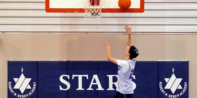 Feb. 28, 2012: Roni Buchine, 14, practices with the Beren Academy boys' basketball team in Houston.