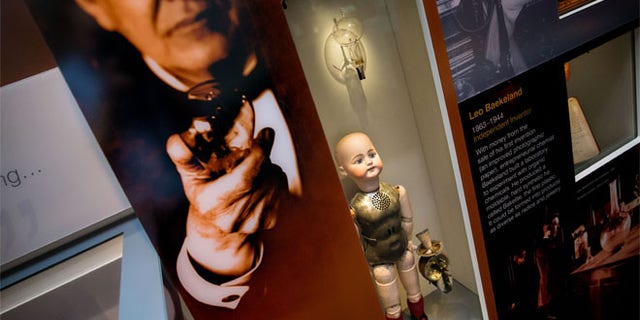 Thomas Edison’s light bulb, top, and a talking dolls that was a flop are displayed at the American Enterprise exhibit at the National Museum of American History.
