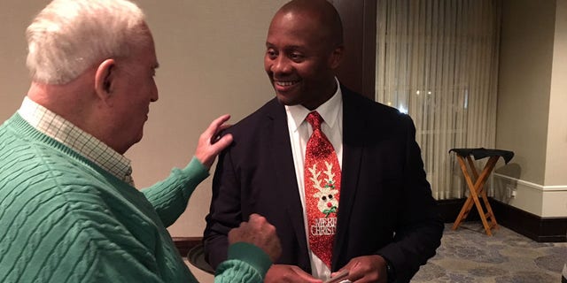 Navy veteran Eddie Edwards works the crowd, hoping for a shot at an open New Hampshire House seat.
