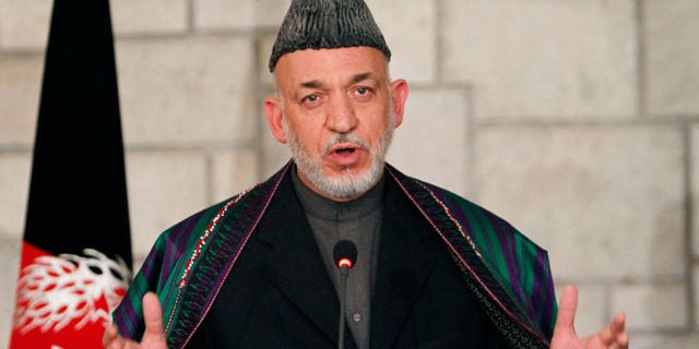 Dec. 14, 2011: Afghan President Hamid Karzai speaks during a joint news conference with U.S. Defense Secretary Leon Panetta, unseen, at the presidential palace in Kabul, Afghanistan.