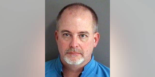 FILE - In this an. 24, 2017, file photo provided by the Story County Sheriff's Office in Ames, Iowa shows John McPhee. McPhee, a former Iowa fire academy administrator, pleaded guilty Wednesday, April 26, 2017, to falsifying test scores that were used to improperly certify thousands of firefighters. (Story County Sheriff's Office via AP, File)