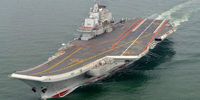 FILE: Chinese aircraft carrier Liaoning cruises for a test on the sea.