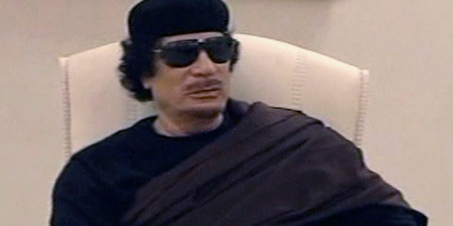 May 11: In this image made from Libyan TV, Libyan leader Muammar al-Qaddafi holds a meeting with tribal leaders from eastern Libya.