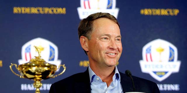 FILE - In this Feb. 24, 2015, file photo, Davis Love III smiles during a news conference introducin him as the 2016 U.S. Ryder Cup captain, at PGA of America in Palm Beach Gardens, Fla. The last Ryder Cup felt like the last straw for the Americans. After yet another loss to Europe, the Americans created a task force to try to find the best captain, to develop the best process for picking a team to have the best chance at winning. (Bill Ingram/Palm Beach Post via AP, File