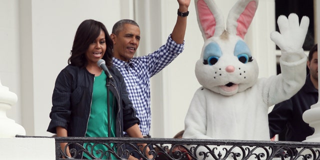 Mar. 28, 2016: President Barack Obama, accompanied by first lady Michelle Obama and the Easter Bunny wave from the Truman Balcony of the White House in Washington to participants on the South Lawn during the annual White House Easter Egg roll.
