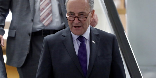 FILE: Senate Minority Leader Chuck Schumer praised the new sanctions.