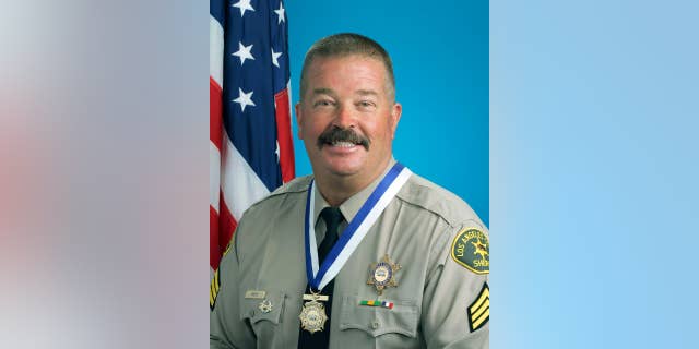 FILE - This Aug. 19, 2014 file photo released by the Los Angeles County Sheriff's Department shows Sgt. Steven Owen. Owen was shot and killed Oct. 5, 2016, while answering a burglary report in Lancaster, Calif. Police motorcycles and cruisers are leading a procession to the memorial service for Owen Thursday morning, Oct. 13. Hundreds of law enforcement personnel are expected to attend along with Owen's family, Gov. Jerry Brown and Attorney General Kamala Harris. (Los Angeles County Sheriff's Department via AP, File)