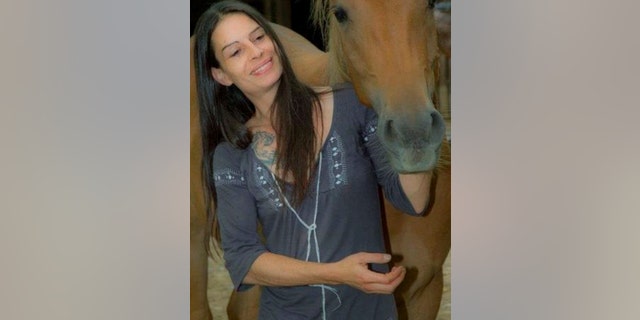 In this photo released by the Spanish Police on Thursday Jan. 23, 2014, 40-year-old Swiss citizen Katharina Katit-Staheli is pictured at an unknown date and location. Spanish authorities allege the Swiss woman detained by police in Torrevieja on the Mediterranean coast killed her 10-month-old baby by cutting its throat and then tried to kill herself on Wednesday Jan. 22, 2014. The mother allegedly took her child, who suffered from a brain abnormality, without authorization from a specialist Swiss clinic and fled to Spain. AP Photo/Spanish Police)