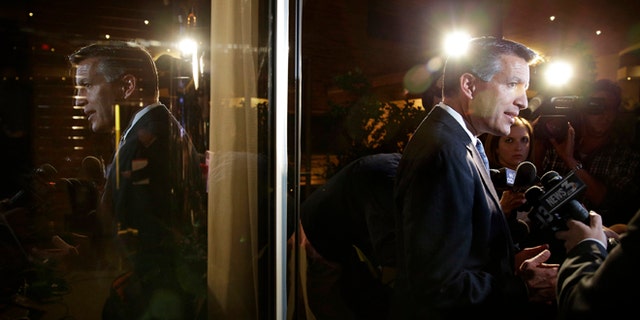 Nevada Gov. Brian Sandoval speaks with members of the media at a Republican victory party Tuesday, Nov. 4, 2014, in Las Vegas. Sandoval defeated Bob Goodman to stay governor of Nevada. (AP Photo/John Locher)